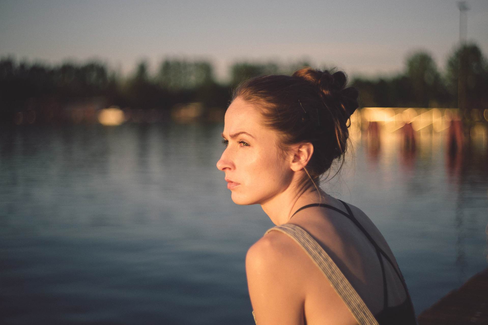 woman staring into lake